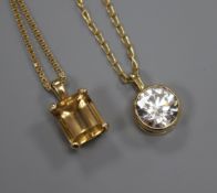 A 9ct gold and cubic zirconia pendant on 18ct gold chain and 9ct gold and citrine pendant on 14ct