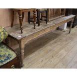 A Victorian long stripped pine table W.259cm