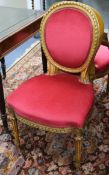 A set of four French giltwood and gesso salon chairs