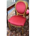 A set of four French giltwood and gesso salon chairs