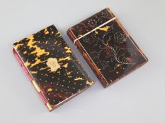 Two 19th century tortoiseshell and pique-work card cases, the first decorated with floral sprigs,