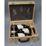 Three bottles of Chateau La Rigalle Bordeaux 2005, in presentation box with three wing glasses