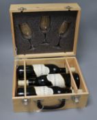 Three bottles of Chateau La Rigalle Bordeaux 2005, in presentation box with three wing glasses