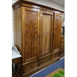 A Victorian Gothic revival pitch pine four piece bedroom suite, comprising a three door wardrobe,