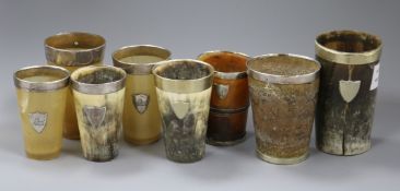 Five assorted Victorian and later silver mounted horn beakers and three other mounted horn beakers.