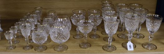 A Stuart cut glass suite of gold rimmed cut glassware