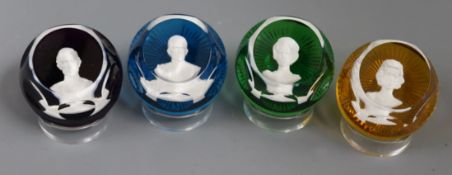 Set of four Baccarat Royal commemorative glass paperweights, dated 1975