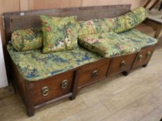 An Indian hardwood long chest with caned top W.194cm