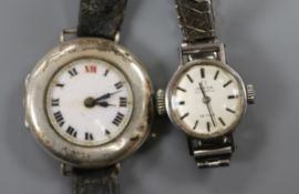 A lady's stainless steel Omega De Ville automatic wrist watch and an early 20th century silver wrist