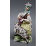 A Chelsea? porcelain figure of a lady Hurdy Gurdy player height 15cm