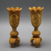 A pair of carved ivory vases