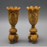 A pair of carved ivory vases