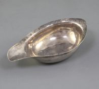 A George III silver pap boat by Walter Brind, with engraved border, London, 1788, 11.4cm.