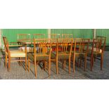 Gordon Russell, extending teak dining table with ten chairs including two carvers W.230cm