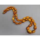 A single strand graduated oval amber bead necklace, goss weight 50 grams, 66cm.ex Congelow House