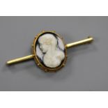 An early 20th century yellow metal and hardstone cameo bar brooch, 49mm.
