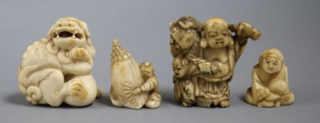 A group of four Japanese ivory or bone netsuke, late 19th/early 20th century