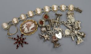 A group of costume jewellery, charm bracelet, cameo bracelet and cameo, antique garnet pendant