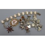 A group of costume jewellery, charm bracelet, cameo bracelet and cameo, antique garnet pendant