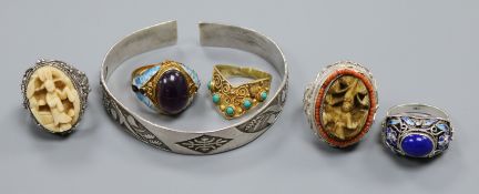 Five assorted white metal and gem set "Peking" rings including amethyst and ivory and a Chinese