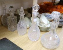 A large French cut glass claret jug, a pair of bottle decanters and two others