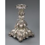 An ornate continental white metal candlestick, loaded, 18.3cm.