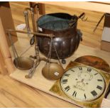A painted longcase clock dial, an 18th century pot, a set of brass scales and three cooking hangers