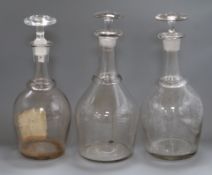 Three large glass decanters and stoppers height 37cm