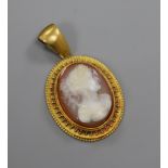A Victorian yellow metal and hardstone cameo oval pendant, 24mm.