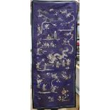 A Chinese silk embroidered panel, worked with figures, dragons and peonies, on a purple ground