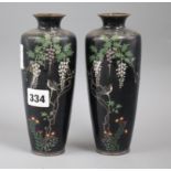 A pair of Japanese cloisonne enamel vases, decorated with flowering prunus, irises and other flowers