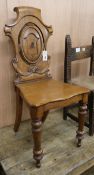 A Victorian oak hall chair