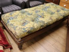 A 19th century Flemish walnut day bed with foliate upholstered cushion W.190cm