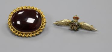 A Victorian yellow metal and cabochon garnet set oval brooch and a later 9ct gold and enamel