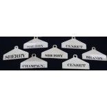 Six 19th century Minton creamware bin labels, of coat hanger form, four marked Minton, all with date