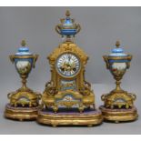 A French porcelain and spelter clock garniture on stand overall height 39cm