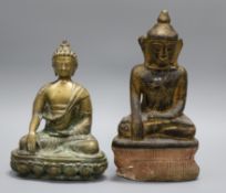 A bronze figure of Buddha and a gilt pottery figure of Buddha tallest 31.5cm