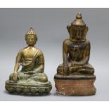 A bronze figure of Buddha and a gilt pottery figure of Buddha tallest 31.5cm