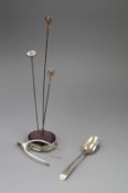 Three hat pins, a silver mounted hatpin holder, pair of silver wishbone sugar nips and a silver