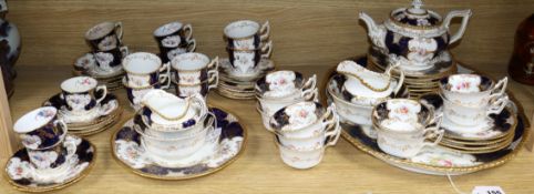 A quantity of Coalport and Thorns Goode blue and gilt teaware