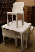 An Artemide Stadio 120 white plastic table and four chairs Table W.82cm