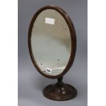 An early 19th century mahogany shaving mirror