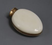 A 19th century yellow metal mounted ivory scent bottle, 57mm.