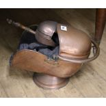 A copper helmet shaped coal scuttle, with swing handle, and shovelex Congelow House