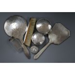 Two silver backed hand mirrors, brush, silver trinket box, a silver pill box and two dressing