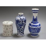 Two Chinese blue and white vases and a famille rose stacking box tallest 22cm