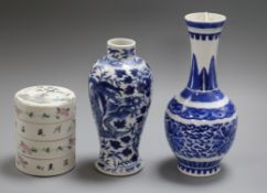 Two Chinese blue and white vases and a famille rose stacking box tallest 22cm