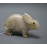 A 19th century Chinese white jade figure of a rabbit, glass inset eyes