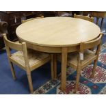 A Conran circular ash table and a set of four rush-seat chairs W.122cm