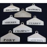 Eight 19th century Minton creamware bin labels, of coat hanger form, impressed date codes, three